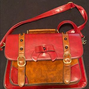 Maroon & brown briefcase with grommets